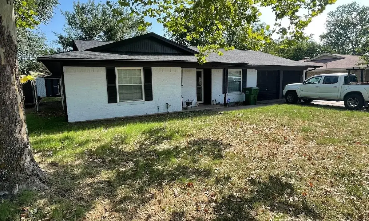 Professional roofing crew working on a residential roof in Oceanport